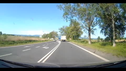 the truck driver idiot is ahead of the other car coming from the opposite direction
