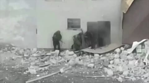 Russians Prepare to Clear a Destroyed House