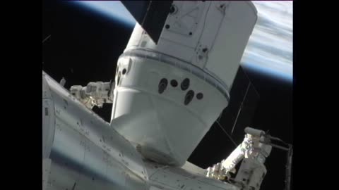 SpaceX Capsule Grappled, Berthed to ISS