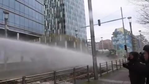 Water cannon v Slurry poo cannon at the European Commission in Brussels..