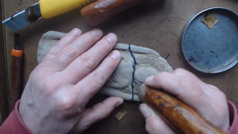 Traditional, lacquer based kintsugi, work on cleanup, Buddhist image