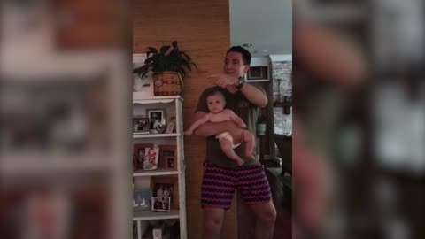 This baby learns to rap and dance with Mom and Dad.