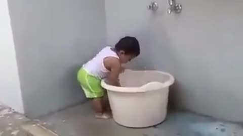 Cute Little Baby helping MOM with Cloth washing