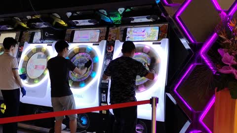 Kids play insane high-paced arcade game in Singapore mall