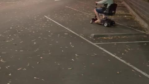 Trying to park a motor scooter