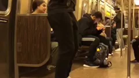 Man rapping on subway train