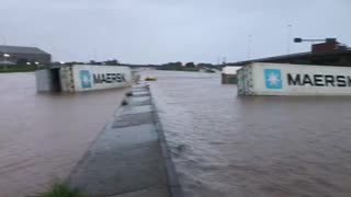 Shipping containers floating and strewn along the vicinity of the Old Durban Airport