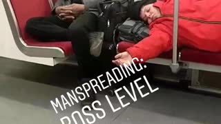 Manspreading: boss level red jacket kid lays down subway