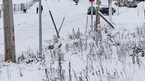 Car Slides Down Snowy Hill In Coyhaique