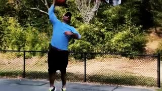 Man tries to slam dunk basketball into hoop and falls down, eminem song
