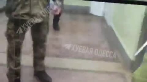 Ukrainian women recording armed Ukrainian recruiters inside a museum gets assaulted.