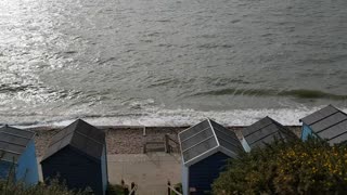 Waves hitting the the shore on a windy day