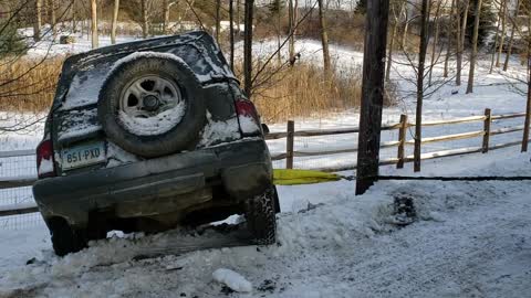 Winching wrecked tracker out of a ditch with my rubicon