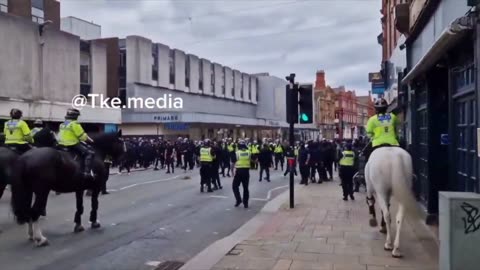 Police deploy horses to deal with the Muslim Defence League in Bolton