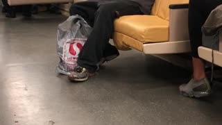 Guy on the subway flashes a flashlight into his face while wearing goggles