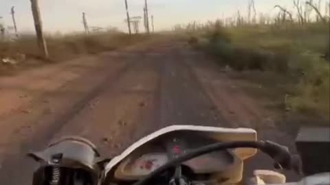 Russian Soldier on a Dirt Bike About to Crash at Any Moment
