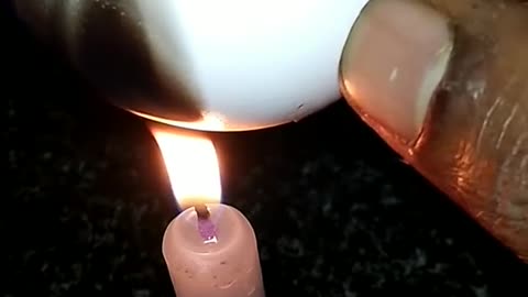 Science experiment with egg and candle watch end