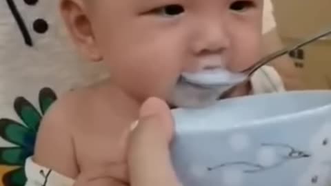 cute baby eating milk