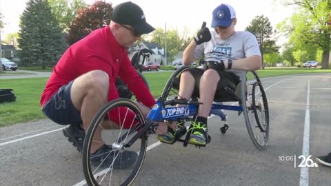 Spina bifida can't stop him from completing a marathon with his dad