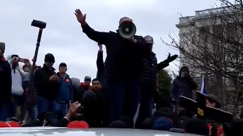 Alex Jones on Jan 6 on a bullhorn urging people away from the US Capitol. Ray Epps urged people in