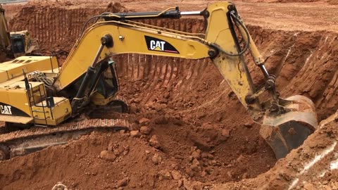 Caterpillar 365C Excavator Loading Trucks And Operator View