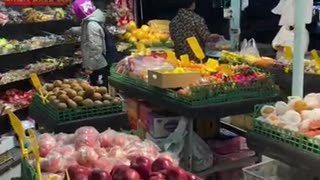 A fruit market in China in the night market.