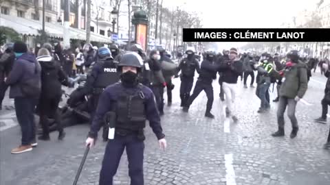 Paris police beat a protester to the ground at the Freedom Convoy protest in Paris, France.