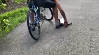 Man Apparently Falls Asleep While Riding Bike