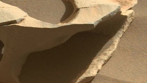 Holes eroded in Mars Rocks, large doughnut shaped rock.