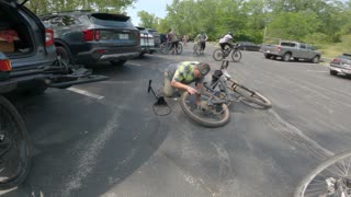 Cap checking his tire