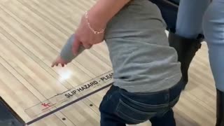 Toddler and Grandma Take a Tumble While Bowling