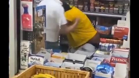 A woman has a word with the convenience store cashier