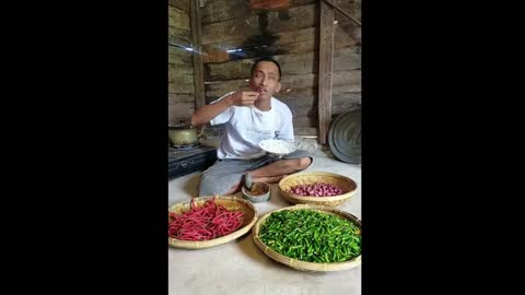 Asian Man eating Chili