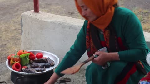 Bake different types of Dolma with red meat and onion and tomato sauce