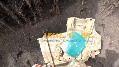 Ukrainian soldier checks the strength of plates for Russian-made body armor