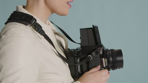 Side view of photographer using medium format camera 02