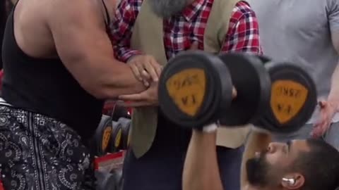 Grandpa showing how weights are carried in GYM