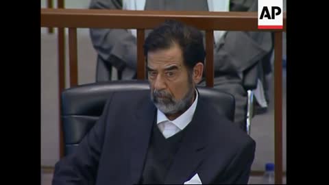 Saddam Hussein in court, says on hunger strike, turbulent scenes