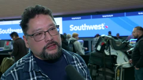 Air travelers in Denver, Colorado react to flight delays