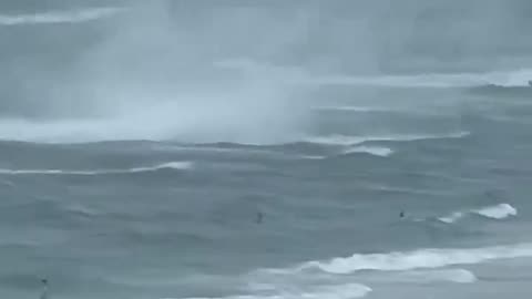 Footage captures waterspout ripping through crowded beach