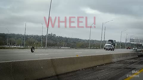 Truck Wheel Rolling Down Highway!