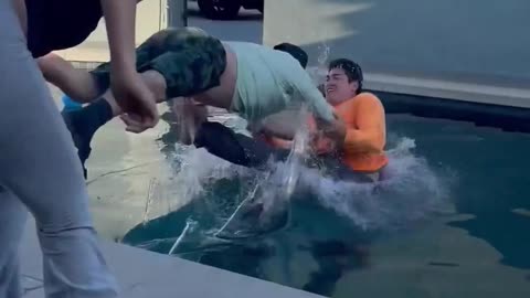 2 Men Try to Throw the Lady to Swimming Pool