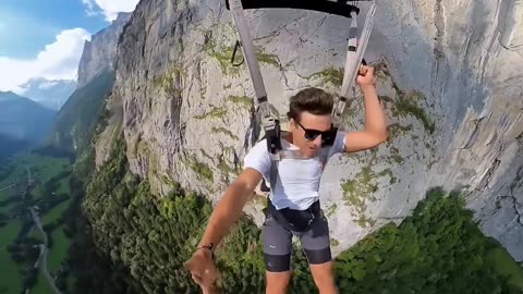 A Guy freaking out of excitement after jumping off a cliff