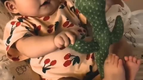 baby funny crying because of dancing cactus toy