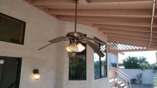 Indoor ceiling fan mounted outside