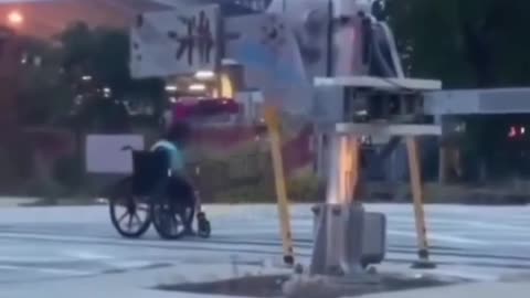 guy in wheel chair crosses train tracks at wrong time..