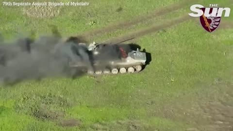 Russian tank explodes as Ukrainian drone drops bomb into open hatch