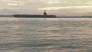 US Navy aircraft carrier USS Gerald R Ford anchors off UK coast