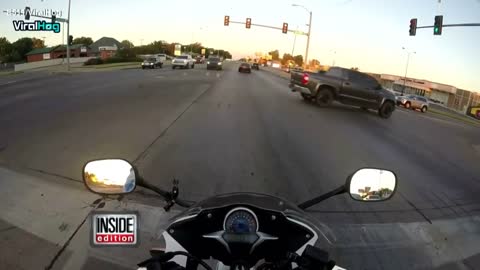 Watch a Motorcyclist Rescue Frightened Kitten from Busy Intersection