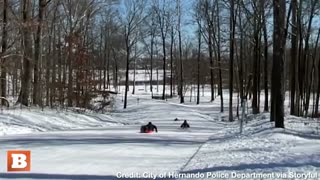 Hot Pursuit! Police Officer Takes on Kids in Sledding Race